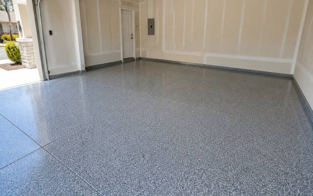 Light grey flake epoxy floor in a garage in Lethbridge